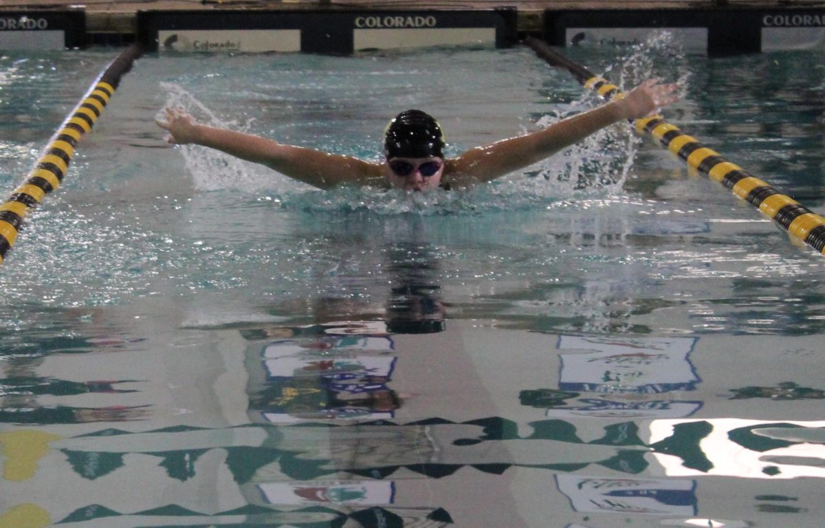 Junior Maddie competing in the 50 Fly race during the Dragon Invitational Swim meet on Saturday.