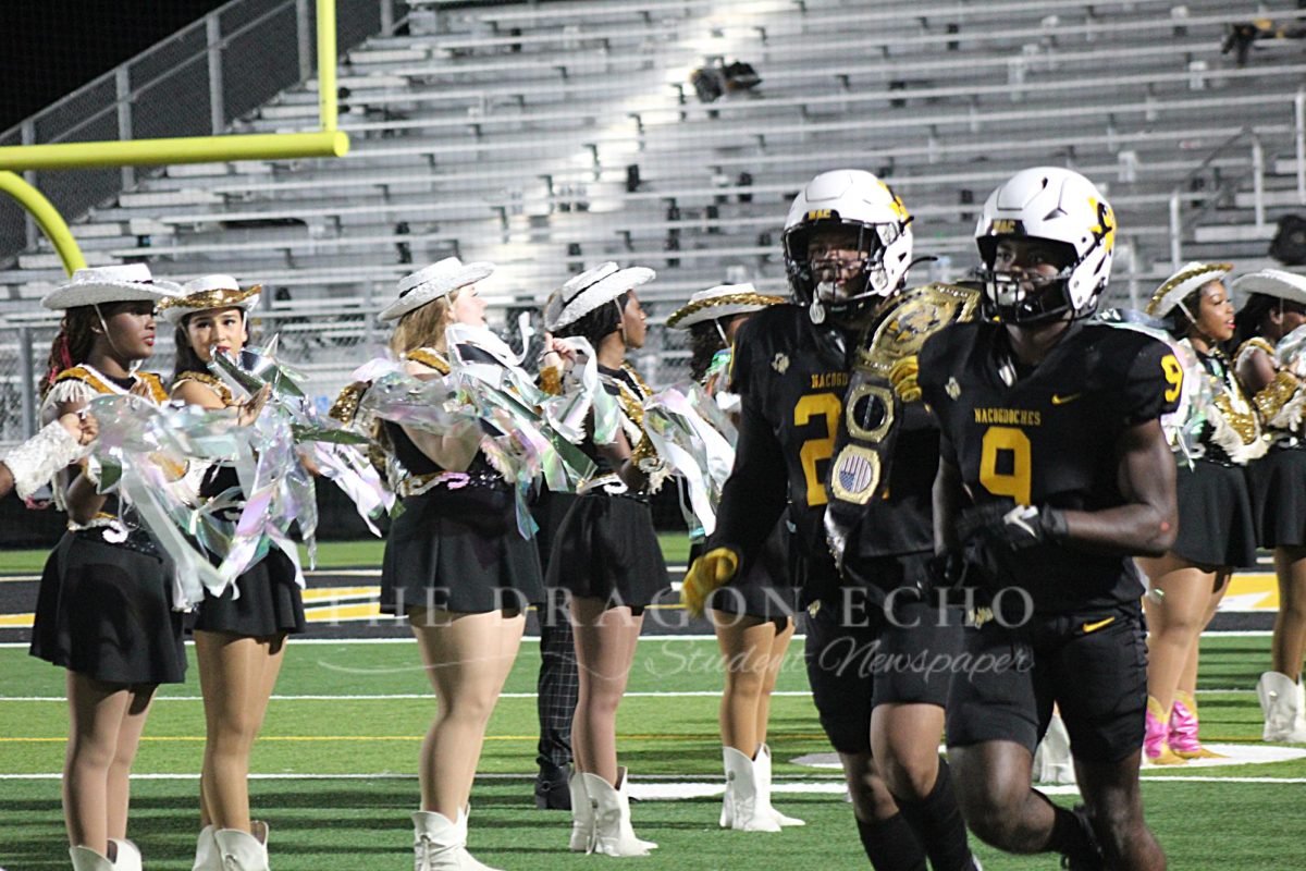 Players take the field after halftime Friday night against the Texas High Tigers.