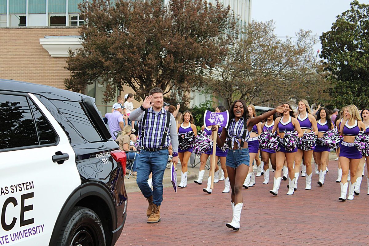 The SFA Homecoming parade, led by the Lumberjack and Ladyjack mascots. Theme for this year is "SFA is Out of This World!" 