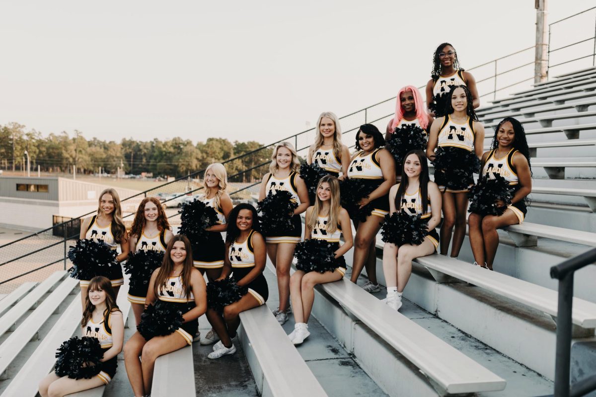 READY FOR A GREAT SEASON Varsity Cheerleaders posing at Dragon Stadium as they prepare for Friday night lights.  Photo courtesy of Three Birds Photography by Brynna Birdwell