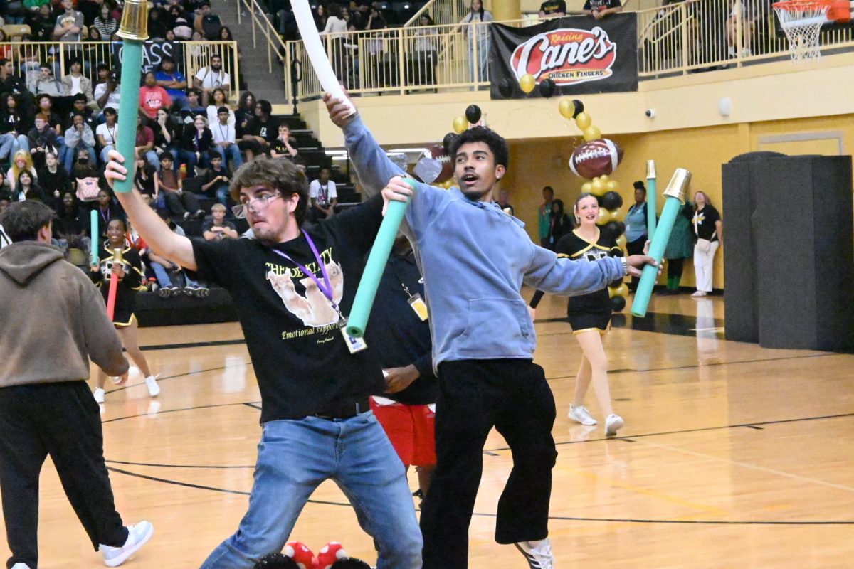Game on!  Seniors Sebastian Darville and Nathanael Carter compete in a fierce game of Noodle Cup at the first pep rally of the year. 