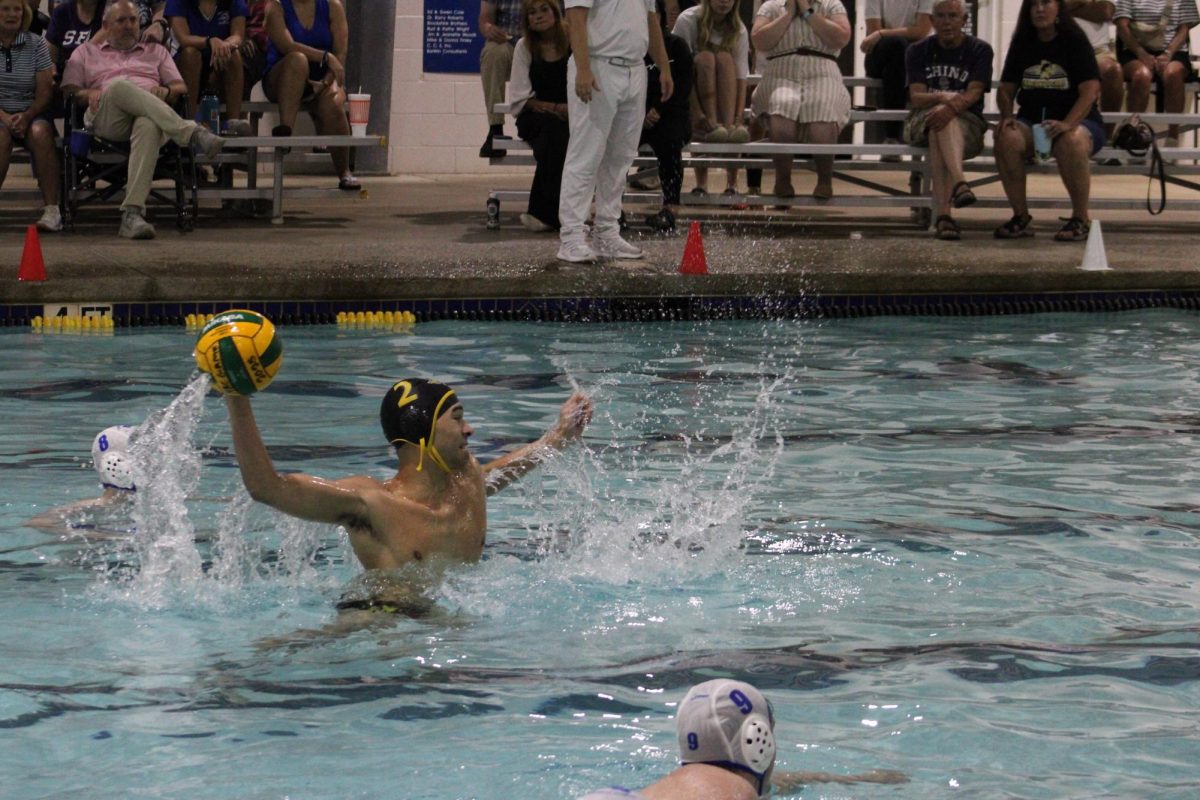 TAKING THE SHOT  Cy Scroggins sets up for a goal during game action against North Forney.